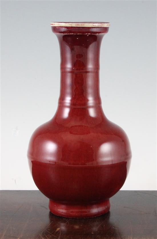 A Chinese sang de boeuf glazed bottle vase, 18th / 19th century, 24cm